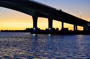 sunset below bridge facing clearwater florida