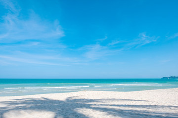Landscape image of tropical white beach with blue sky background