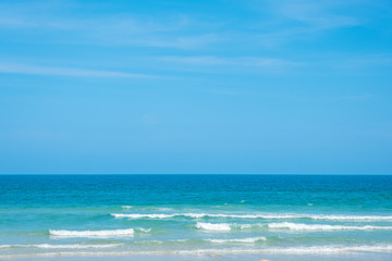 Landscape image of tropical white beach with blue sky background