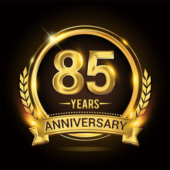 Celebrating 85th years anniversary logo with golden ring and ribbon, laurel wreath vector design.