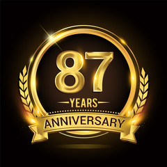 Celebrating 87th years anniversary logo with golden ring and ribbon, laurel wreath vector design.