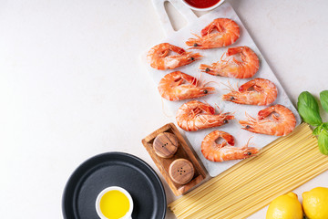 Raw ingredients for cooking: Shrimp prawns Italian spaghetti