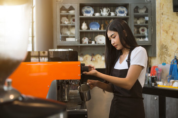 Coffee maker with staff being used. Employees working with coffee makers.