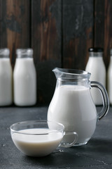 Fresh milk in different glass bottles