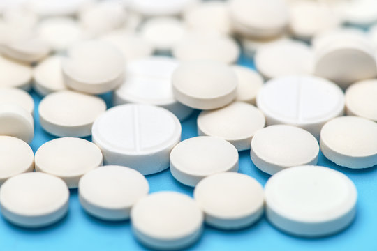 Macro photo of pills. Close-up of round white pills.