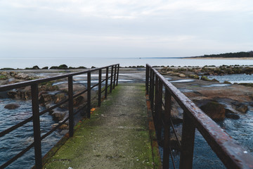  asphalt road leading to the sea