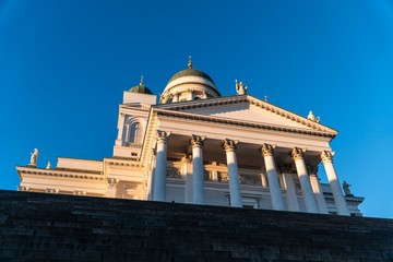 building with columns against a blue sky