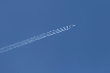 plane flying in a blue sky