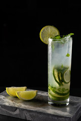 Mojito cocktail is on the bar. Space for text. Photo for the menu.