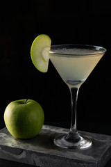 Apple Martini cocktail is on the bar. Space for text. Photo for the menu.
