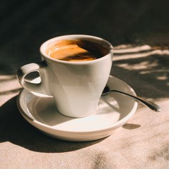 Cup of coffee on table in cafe