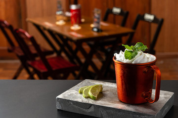 Muscle mule cocktail is on the bar. Space for text. Photo for the menu.