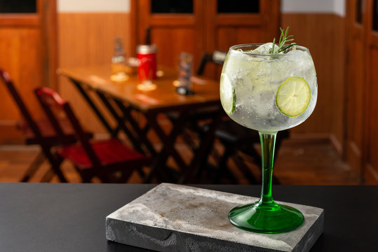 Gin tonic cocktail is on the bar. Space for text. Photo for the menu.