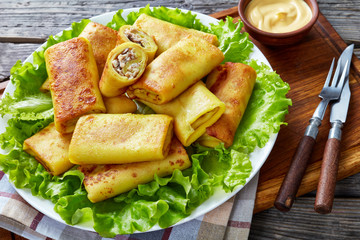Savory crepe rolls with ground chicken meat