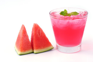 Watermelon juice with mint in glass and slice watermelon isolated on white background