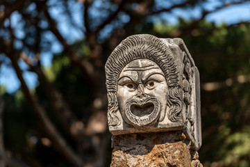 Obraz premium Theater mask - Roman amphitheater Ostia Antica - Rome Italy
