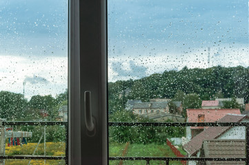 The view of rainy weather. Inclement weather outside the window.