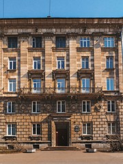 The facade of the historic old building with sculptures in St. Petersburg	