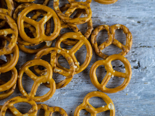 Crackers with salt and sauce on a wooden background