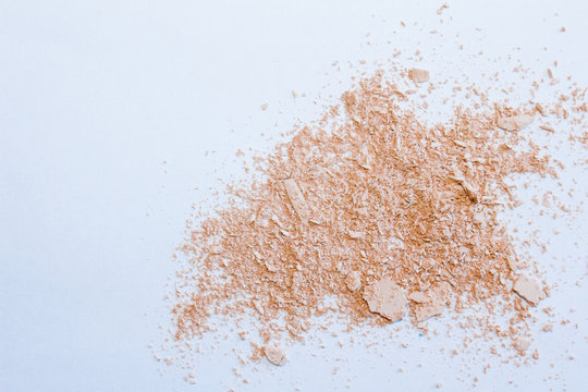 Face powder stroke isolated on white background. Make up. Beauty textures .Cosmetic background for beauty, fashion blog. Crumbling Face powder