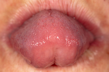 Tongue in a man's mouth.