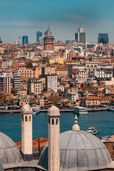 Cityscape capture of Istanbul with Galata Tower and modern skyscapers in frame.