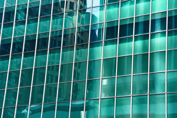 High glass skyscrapers on the streets of Singapore. Office windows close up