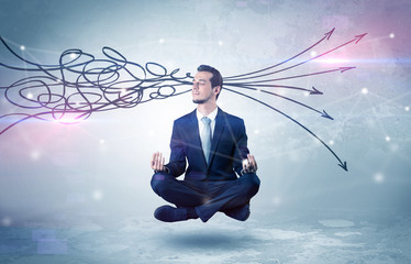 Businessman levitates in yoga position and systematize with thinking concept
