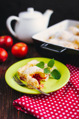 A slice of apple pie with mint