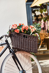 Fototapeta na wymiar Vintage bicycle with basket against white wall background. Close-up