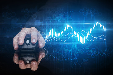 Hand using wireless mouse with statistical concept on dark background
