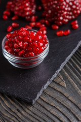 grains of a grenade on a dark rustic background