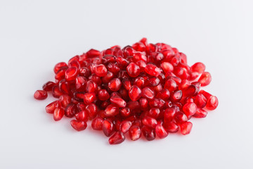 grains of a grenade on a white acrylic background