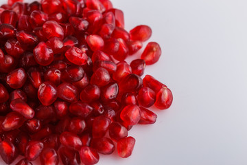 grains of a grenade on a white acrylic background