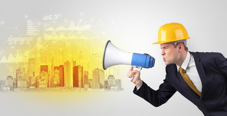 Fototapeta premium Young supervisor architect yelling to a big city panorama 