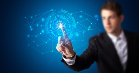Man touching hologram screen displaying keys and locks