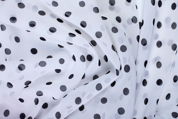 Crumpled black and white polka dot fabric texture