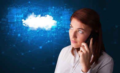 Person talking on the phone with blue cloud technology concept
