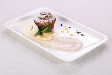 Tasty hot muffin with ice cream