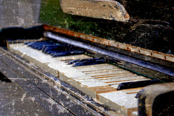 Broken old piano. Selective focus point on Old vintage piano keys - vintage filter effect.