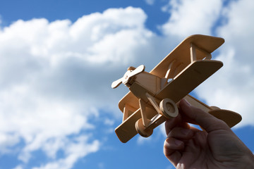 Toy airplane in hand - a symbol of travel and dreams © Stanislaw Mikulski