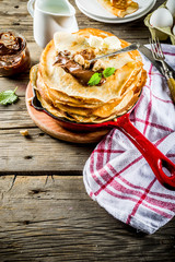 Homemade crepes with chocolate sauce