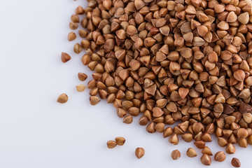 Grain buckwheat on a white acrylic background