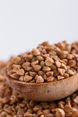Grain buckwheat on a white acrylic background