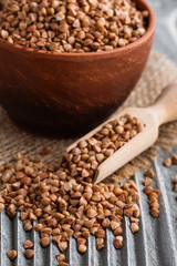 Grain buckwheat on a gray wooden background