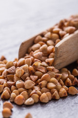Grain buckwheat on a dark stone background