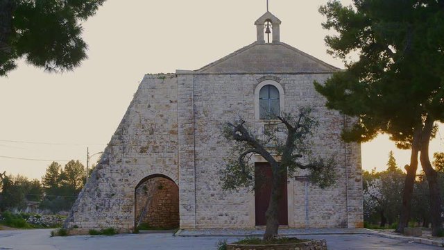 small church in the countryside of Palo del Colle (Puglia - Italy), on the facade there is a tourist sign that shows the following indication: "Church of the Crucifix of Auricarro Sec. XIV"