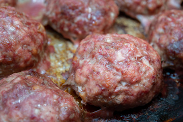 Meat cutlets cooked on a baking sheet in the oven