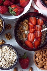 granola with nuts-almonds,hazelnuts and strawberries for Breakfast top view
