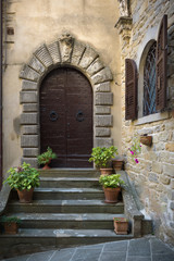 Very old door of the house in a Tuscan village.